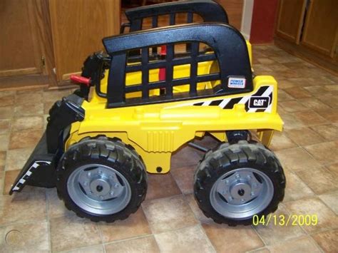 power wheels caterpillar skid steer|cat skid steer attachments.